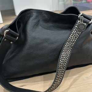 Streets Ahead slouchy black leather tote with silver toned metal stud details